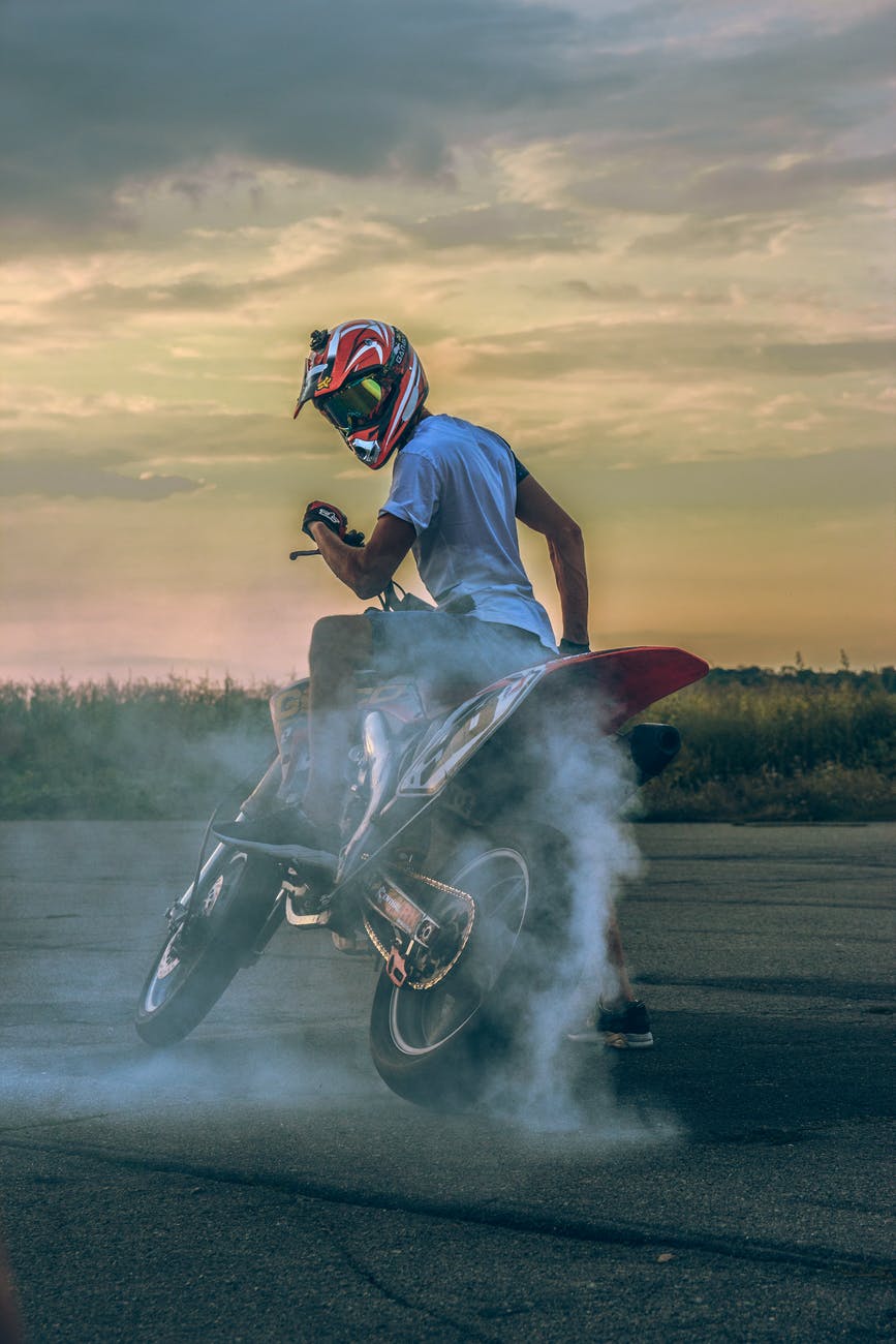 photo of man riding motorcycle