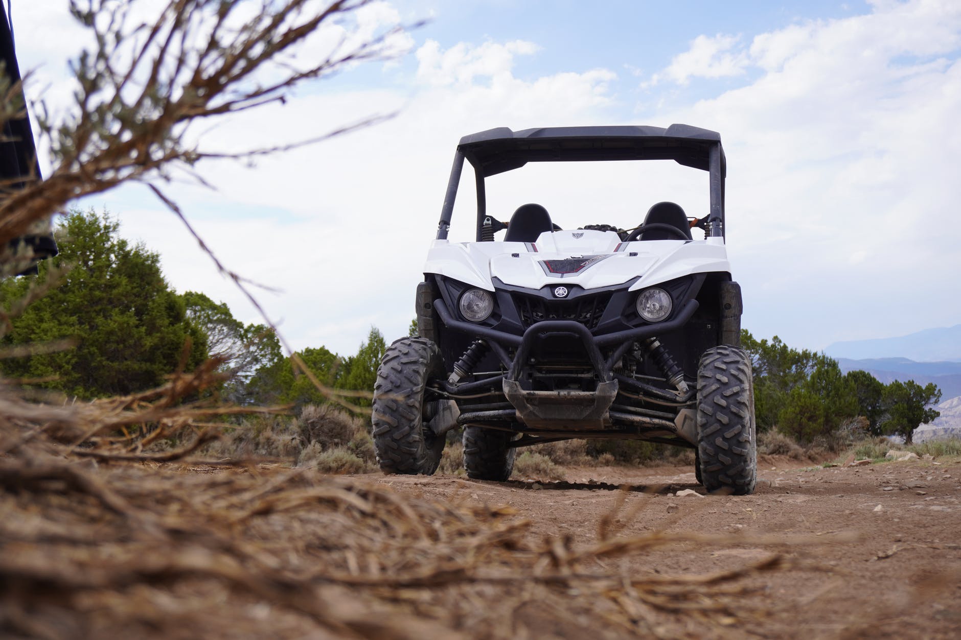 black and gray utv on brown ground